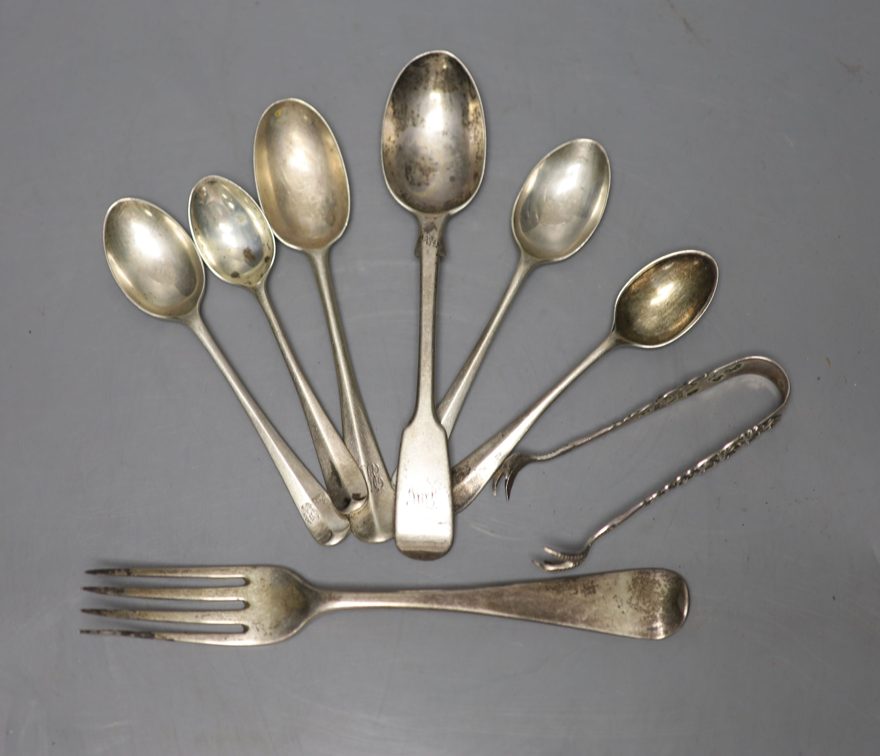 Six assorted silver teaspoons, a silver dessert fork and a pair of silver sugar tongs, 174 grams.